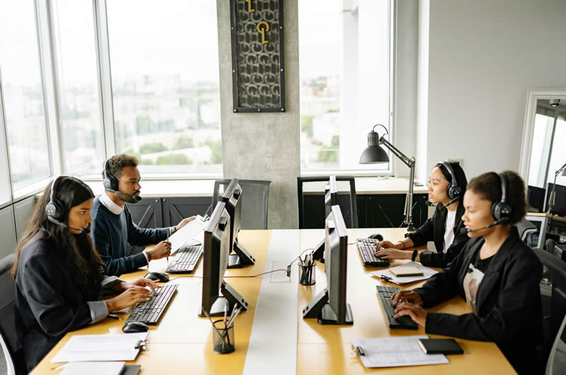 Team working on computers in a workplace